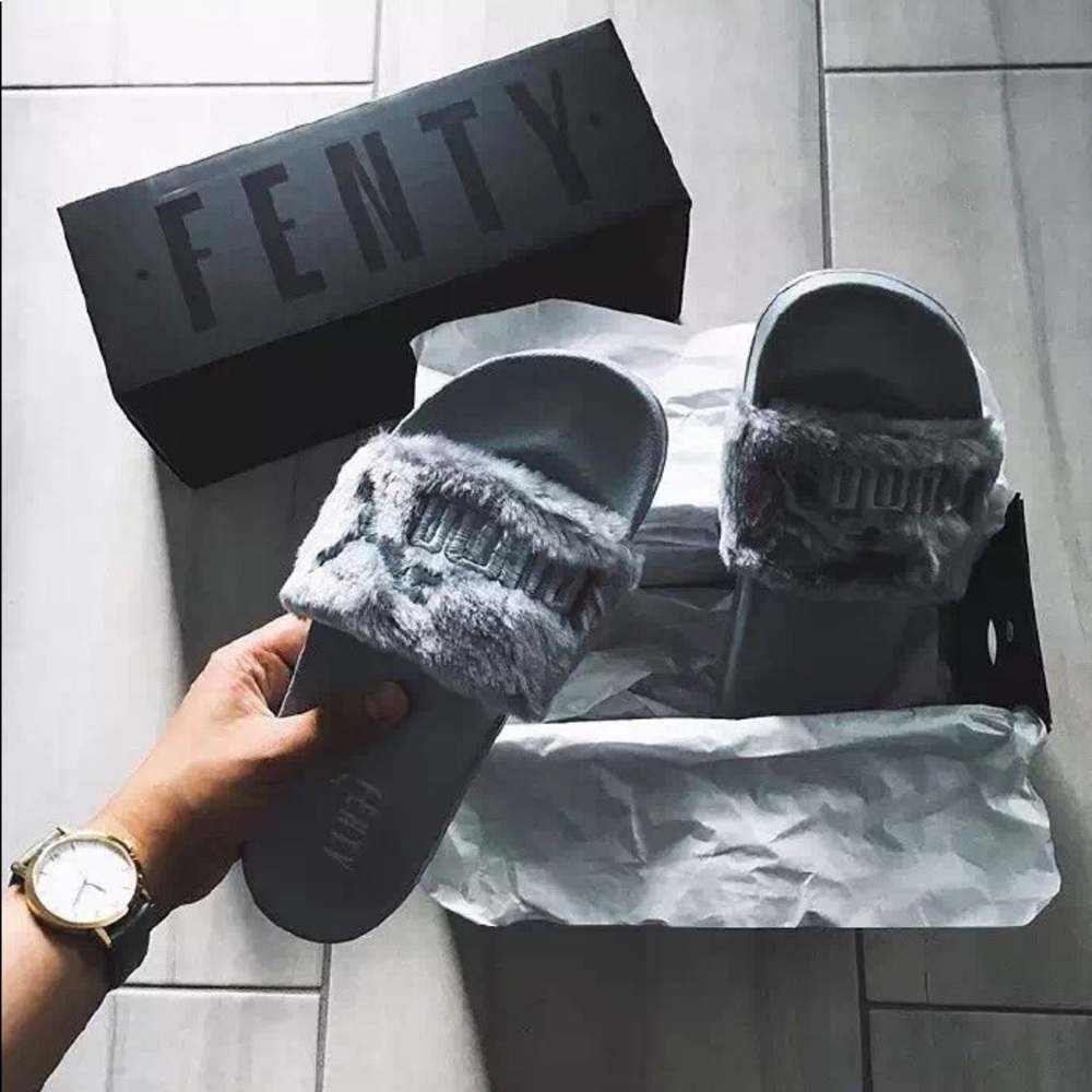 Puma slippers new with tag and dust bag.